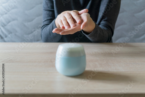 Woman doing the manicure. Removing the polish and putting on the cream. Woman that care his hands. Style concept.