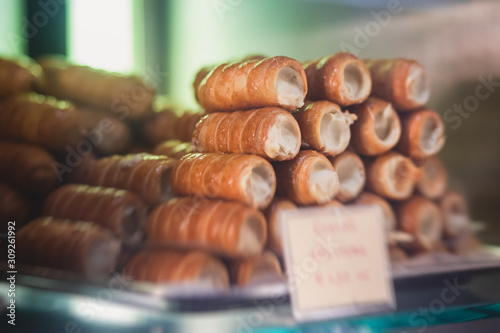 View of different traditional italian pastry candy desserts assorment, with cannoli, panna cotta, tartufo, amaretti, panettone, zeppole bomboloni, semifreddo, cartocci and others in Rome, Italy photo