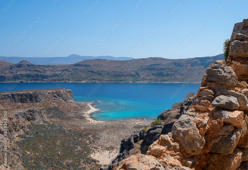 view from a high mountain to a quiet sea Bay with turquoise water