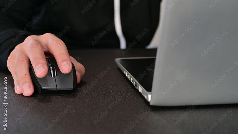 Man browsing internet, scrolling and clicking on the mouse Man browsing internet, scrolling and clicking on the mouse
