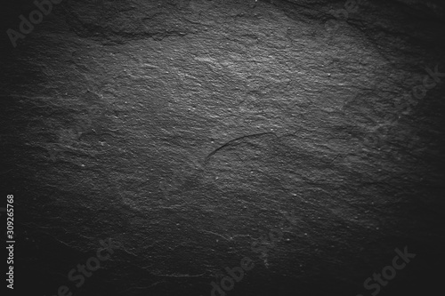 Close up view of black slate background for design. Dark rough texture. 