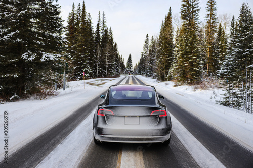 Electric car driving, mountains snow
