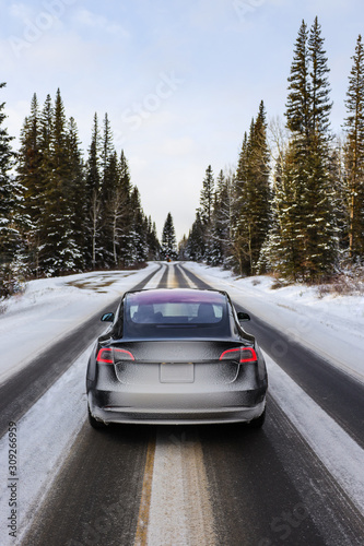 Electric car driving, mountains snow