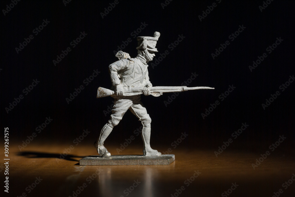 Napoleon era soldier standing with rifle and bayonet Napoleon era soldier standing with rifle and bayonet