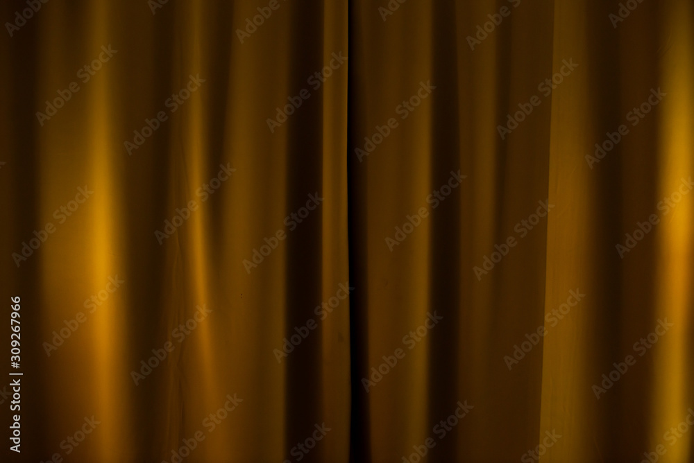 Brown-bronze theater curtain. Background from blackout curtains.