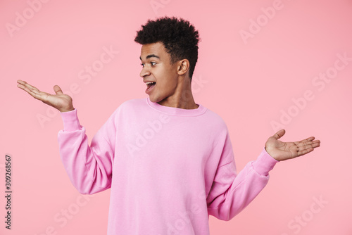 Portrait of a smiling african teenager boy wearing pullower photo