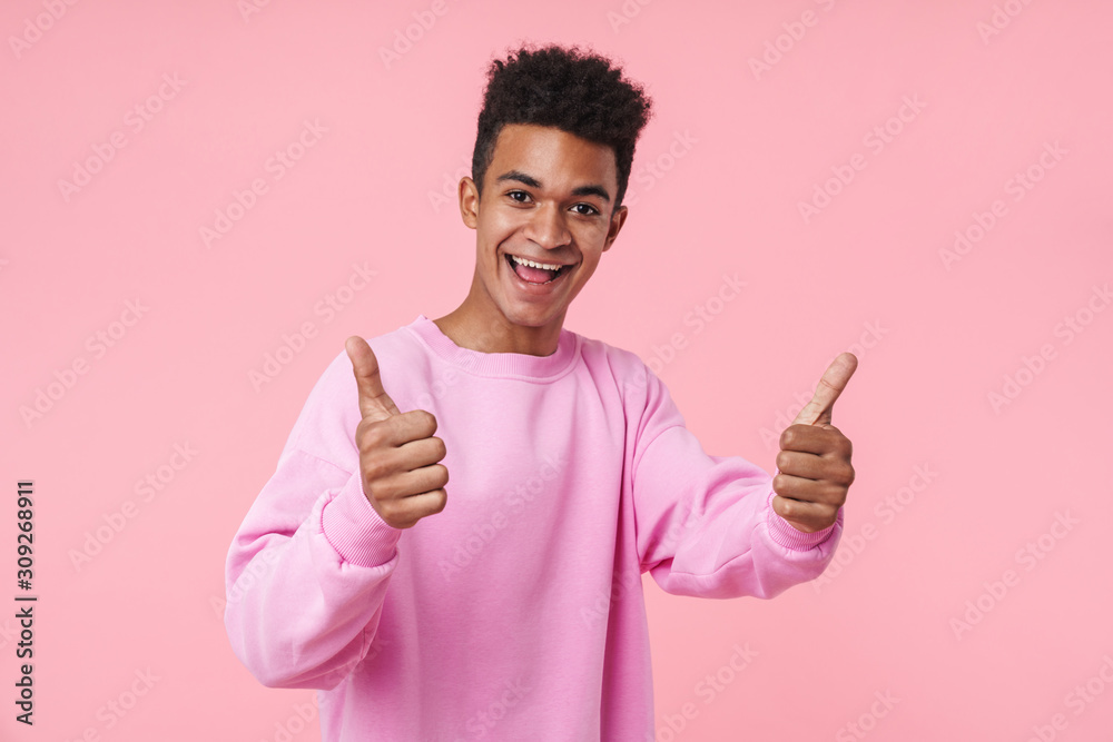 Portrait of a smiling african teenager boy wearing pullower Portrait of a smiling african teenager boy wearing pullower