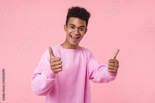 Portrait of a smiling african teenager boy wearing pullower photo