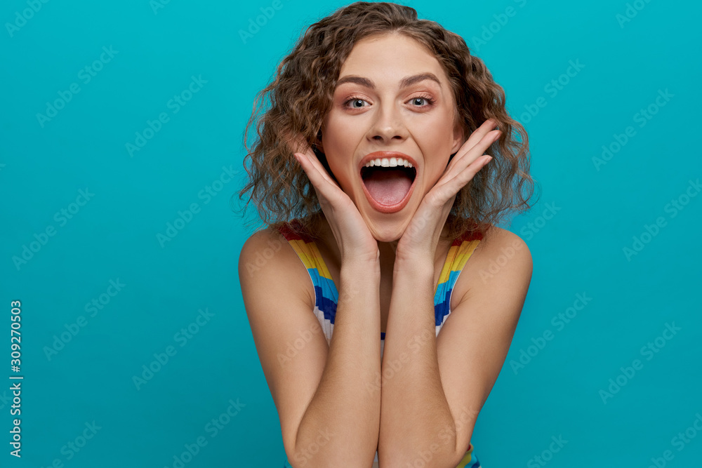 Happy model with curly hair looking at camera, smiling. Happy model with curly hair looking at camera, smiling.