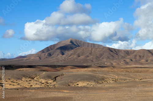 Volcanic landscape of Lanzarote  Canary Islands  Spain  dramatic scenery painted by sand  rocks .