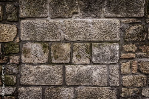 Ancient red stone wall flat background closeup photo