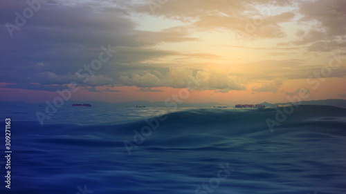 Dramatic dusk over the Aegean sea with beautiful colours and clouds as seen from cruising yacht in Cyclades isalands  Greece