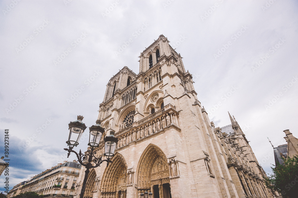 Fototapeta premium Notre-Dame Cathedral of Paris. Facade of the Notre-Dame cathedral of Paris