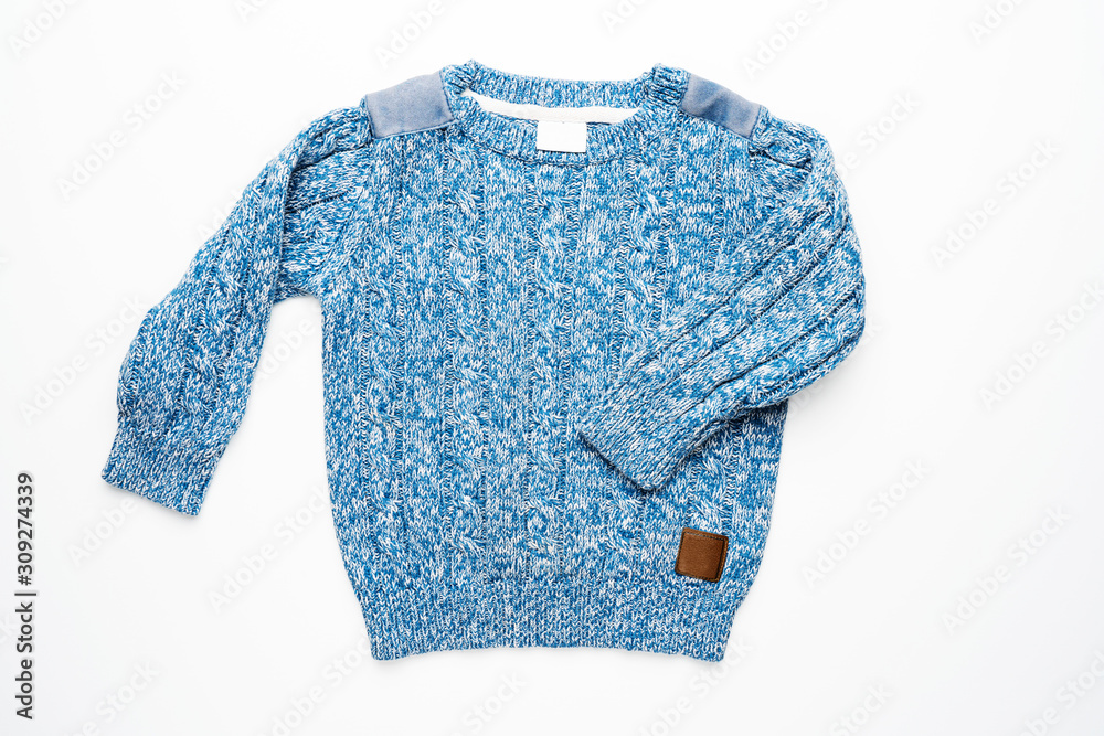 Fototapeta premium Kids knitted sweater with pattern. Beautiful blue woolen autumn sweater with long sleeves. Front view. On white background