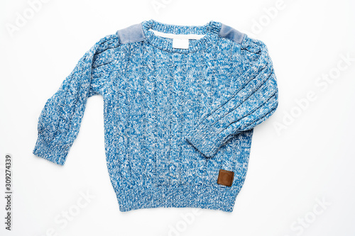 Kids knitted sweater with pattern. Beautiful blue woolen autumn sweater with long sleeves. Front view. On white background