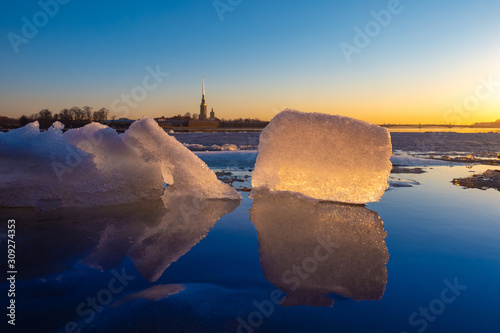 Saint Petersburg. Russia. Peter-Pavel's Fortress. Ice blocks go along the Neva. Dawn over the Neva. Travel to St. Petersburg. Landscapes of winter Russia. Sightseeing tour of the Neva. Excursions. photo