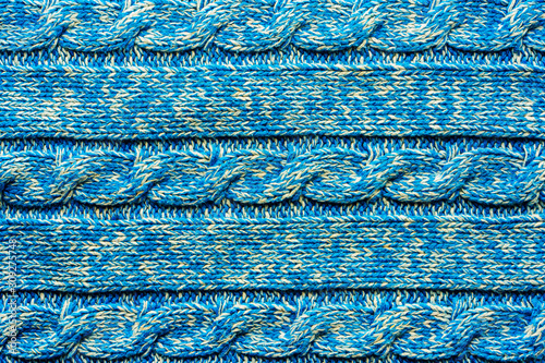 Photography The texture of a knitted blue white sweater