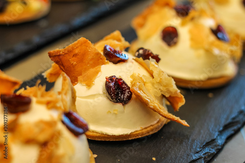 row of amarena desserts with custard and crunchy pastry in typical Italian pastry © stefano