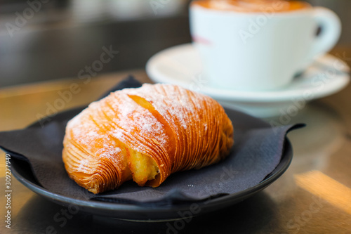 typical Italian breakfast in the cafeteria with sfogliatella and cappuccino