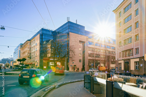 Street view with Glass Business office building architecture Salzburg sunset