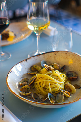 Fotografie, Tablou fresh bronze-drawn spaghetti and a sprinkling of parsley and Cilento oil with a