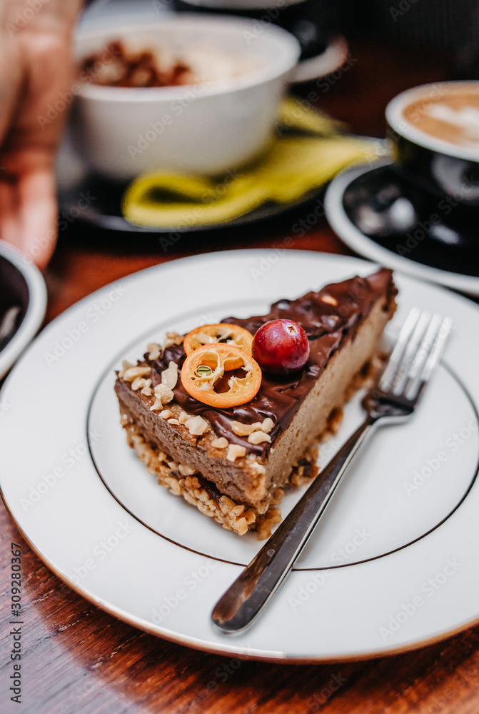 Raw vegan chocolate cake with peanuts, healthy sweets.