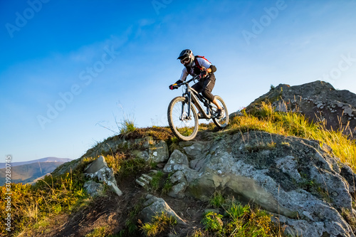 A man is riding enduro bicycle. photo