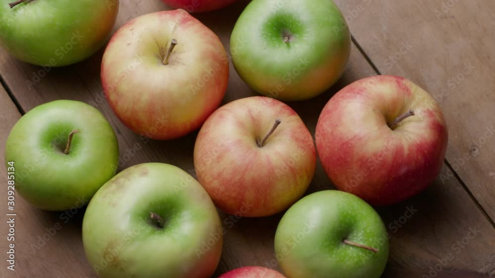 red and green apples on a wooden background red and green apples on a wooden background