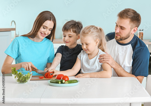 Happy family cooking togeth...