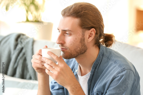 Handsome man drinking coffe...