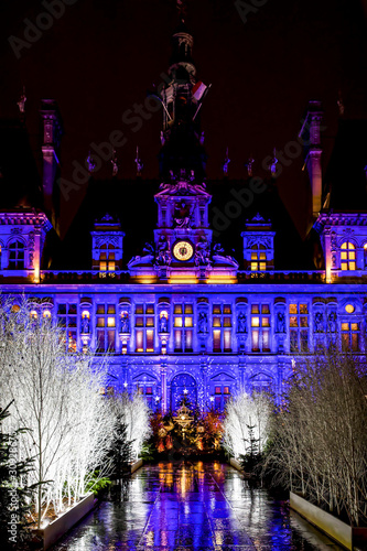 Paris, France - December 12, 2019: Parisian City Hall (Hotel de Ville) decorated for Christmas at night