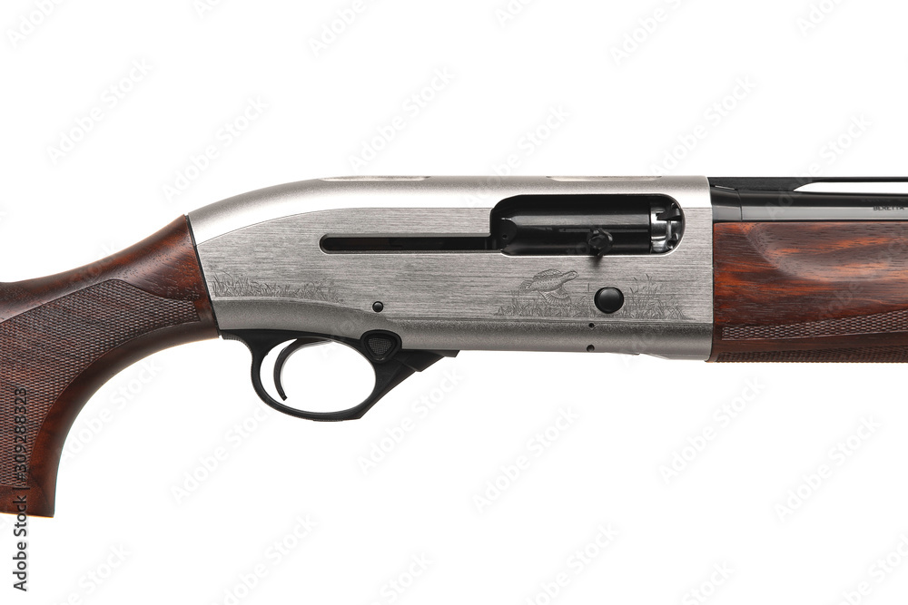 Hunting semi-automatic shotgun with wooden butt isolate on white background Hunting semi-automatic shotgun with wooden butt isolate on white background