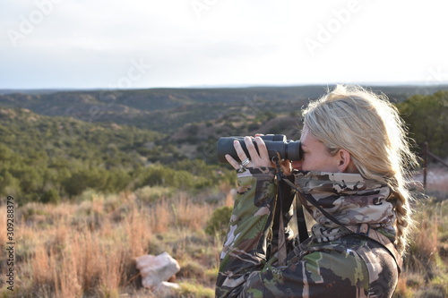 Girl with Binoculars Outdoors Hunting