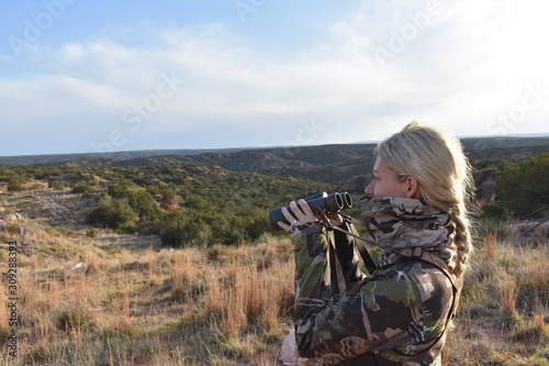 Woman with Binoculars outside