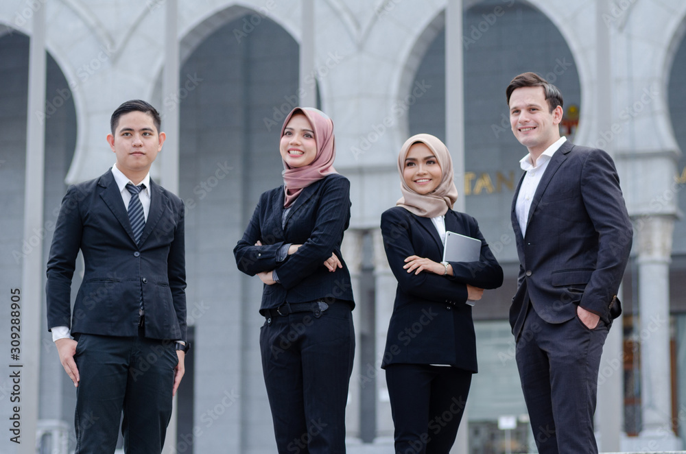 Portrait group of young executive, dressed in formal standing with happy face expression Portrait group of young executive, dressed in formal standing with happy face expression