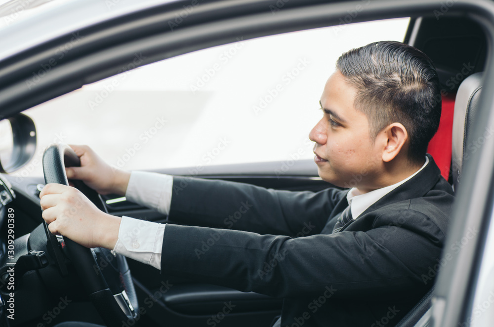 side view young businessman sitting in his car and drive to work place side view young businessman sitting in his car and drive to work place