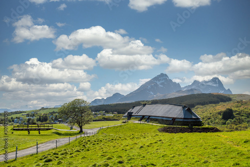 Fotografie Lofotr long house, a home for vikings in the viking era, during daytime with white clouds
