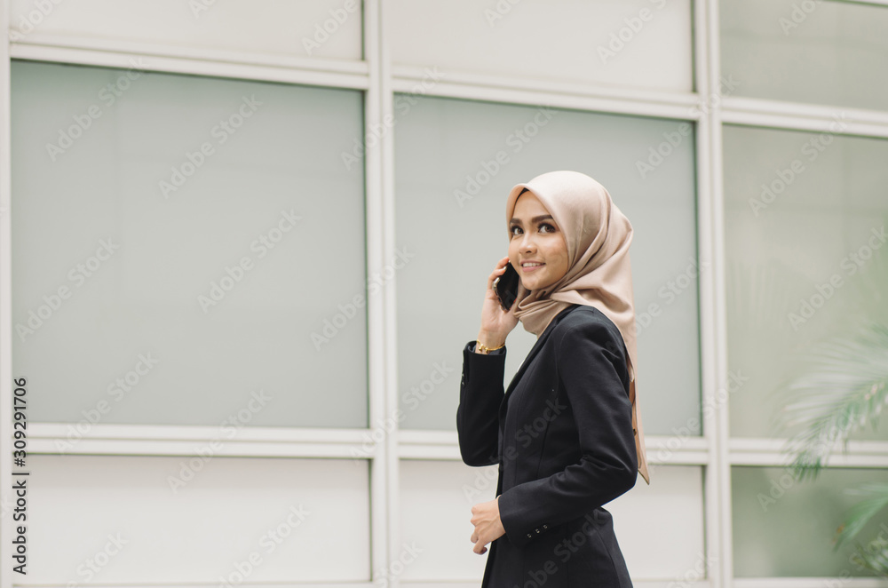 Portrait of young Office Woman Talking to Someone on her Mobile Phone with Happy Facial Expression. Portrait of young Office Woman Talking to Someone on her Mobile Phone with Happy Facial Expression.