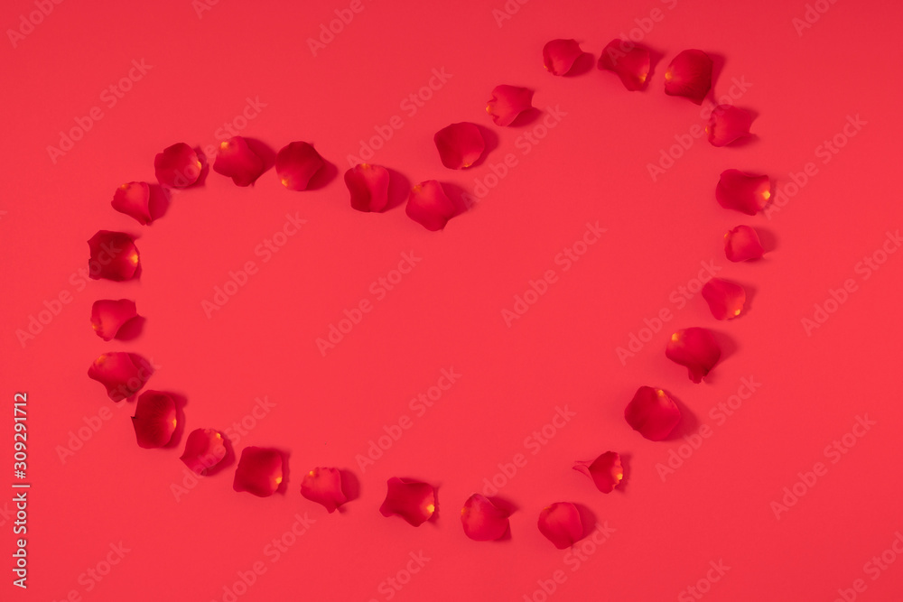 Valentine's Day background. Beautiful rose petals on red background. Valentine day concept. Flat lay, top view, copy space