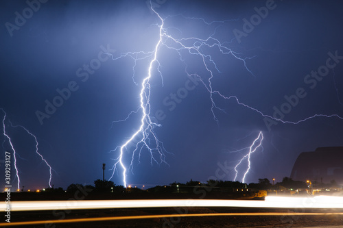 lightning over city photo