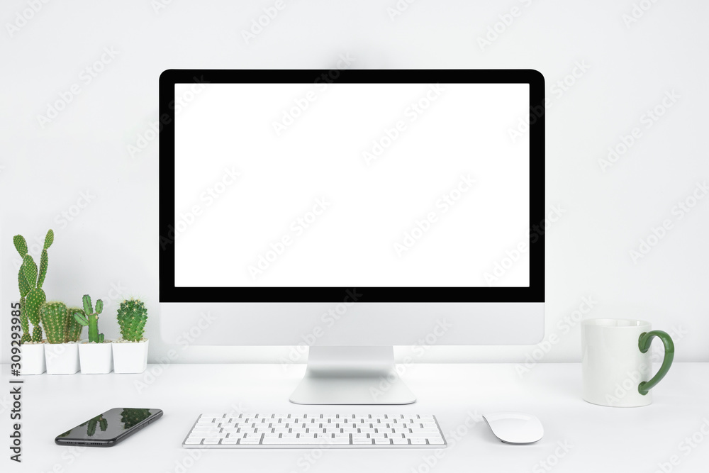 Computer with blank white copy space for text, Mockup design desktop computer in office on white table with keyboard and Coffee cub, Work place concept, Cactus in pot. Computer with blank white copy space for text, Mockup design desktop computer in office on white table with keyboard and Coffee cub, Work place concept, Cactus in pot.