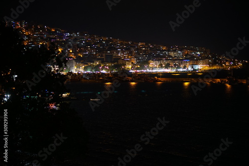 night views in the port city.small fishing boats in the harbor, the seashell reflecting on the sea