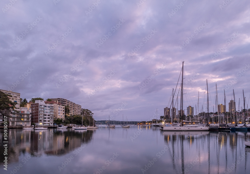 Apartments and yachts under clouds