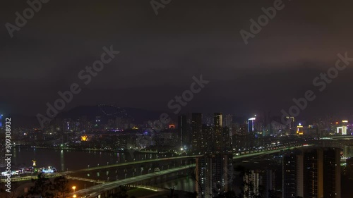 Macau – Zhuhai border earial cityscape night timelapse pan up photo