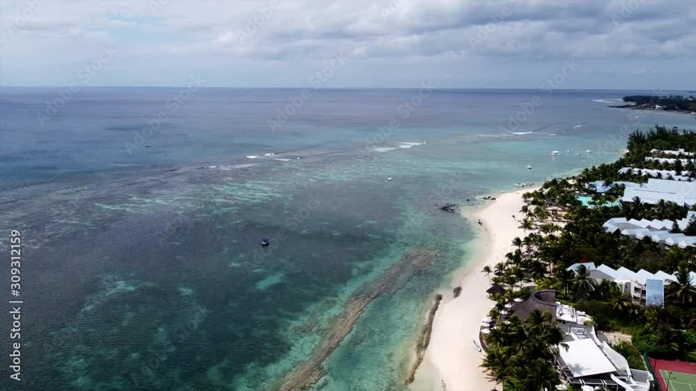 Flying over mauritian seaside beach promenade and indian ocean,mauritius Flying over mauritian seaside beach promenade and indian ocean,mauritius
