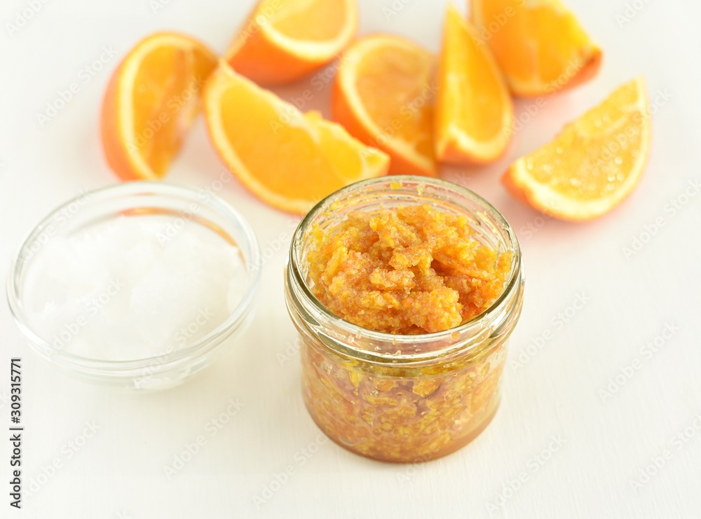 Orange peel, brown sugar, coconut oil body or lip scrub, natural, homemade cosmetics. Orange peel, brown sugar, coconut oil body or lip scrub, natural, homemade cosmetics.