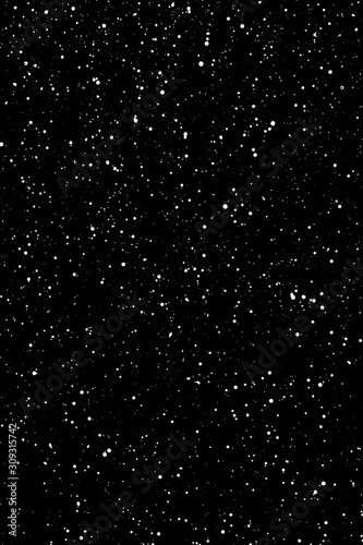 Chaotic white star bokeh on a isolated black background. falling blurry bokeh snow overlay  starry sky. white spots on black background  white drops and spots. abstraction.