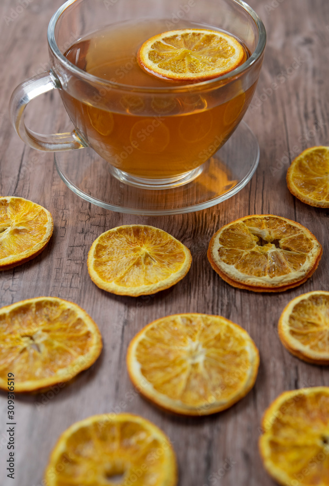 A warm cup of tea with orange and  anise ,herbal tee