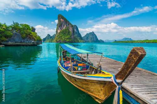 Beautiful nature scenic landscape Phang-Nga bay with wooden boat moored on pier waiting traveler, Water travel adventure Phuket Thailand, Tourism destination scenery Asia, Summer holiday vacation trip