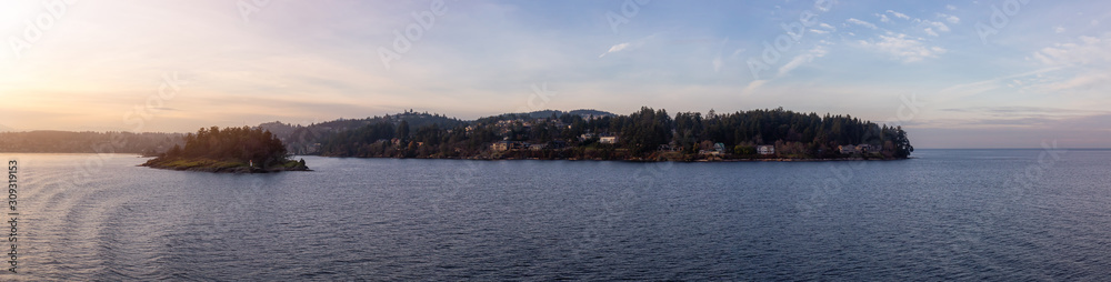 Nanaimo, Vancouver Island, British Columbia, Canada. Panoramic View of Residential Homes in the Modern City by the Ocean during a colorful sunset.